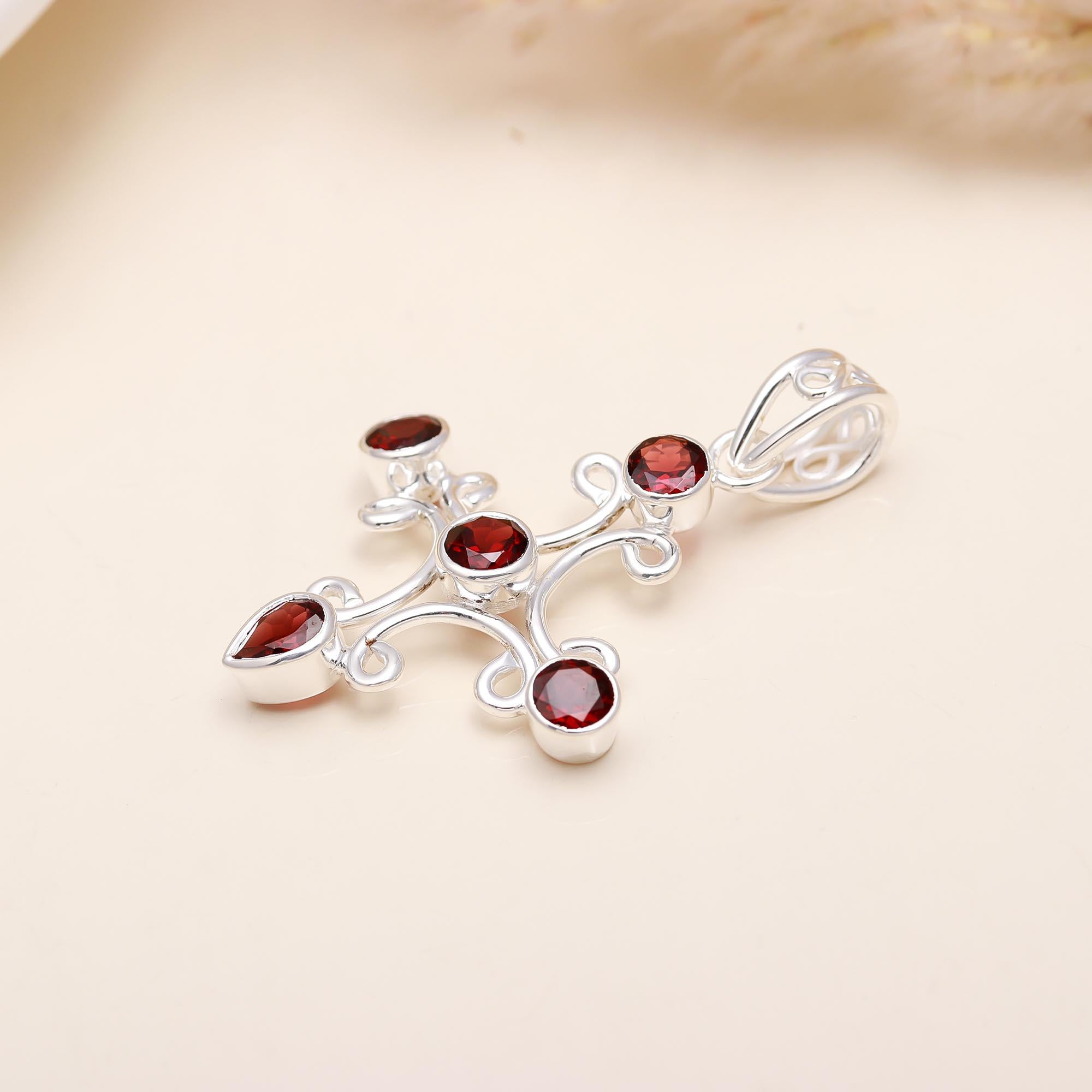 A Jewels Classy Cross Garnet Pendant