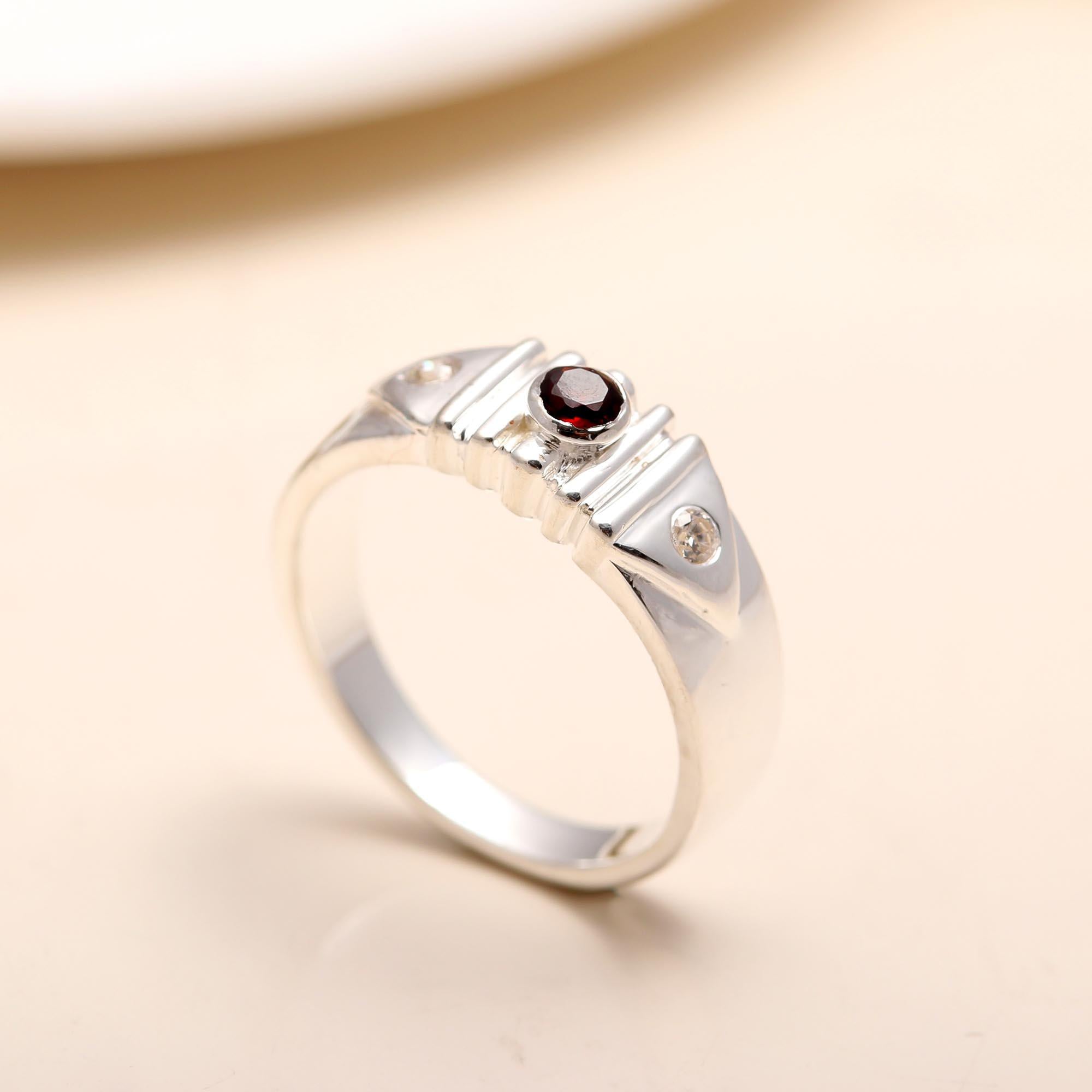 Statement silver ring featuring garnet and cubic zirconia