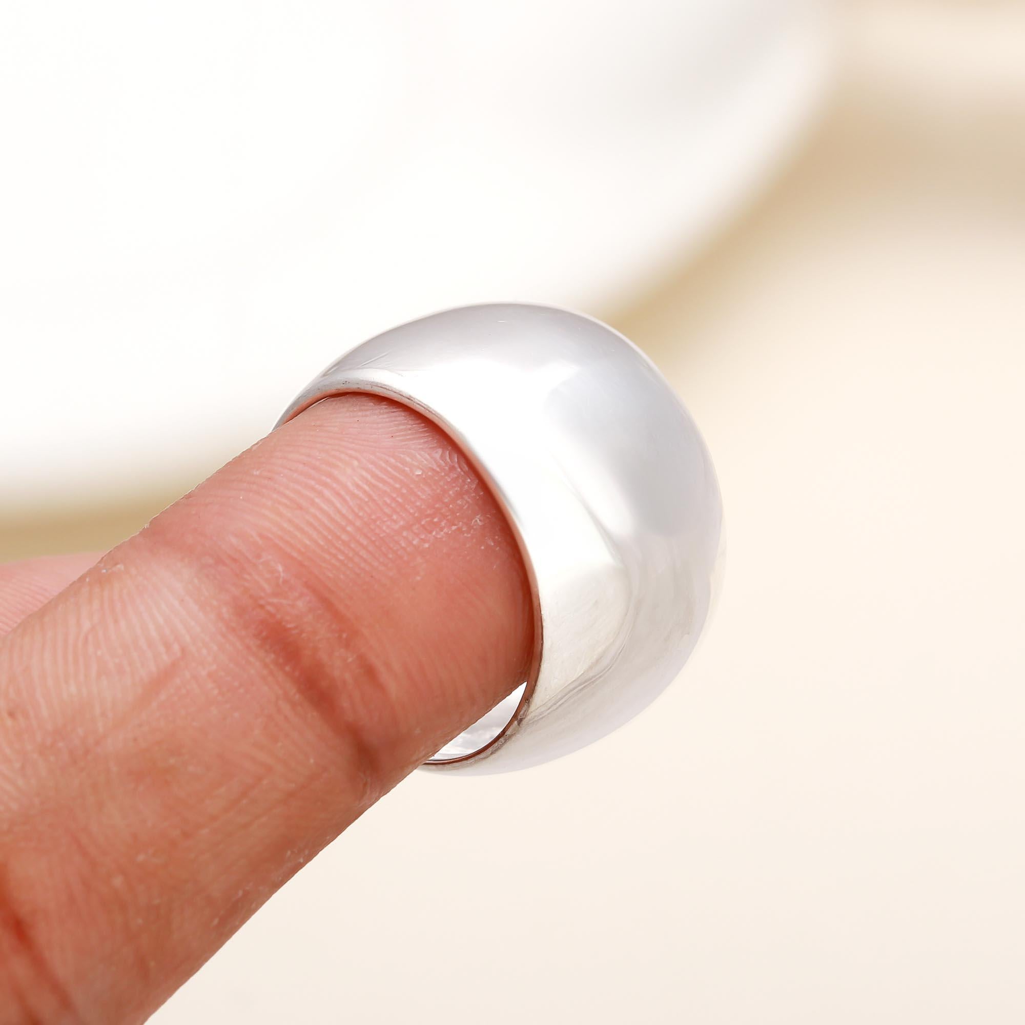 Sterling silver wide dome statement ring on finger