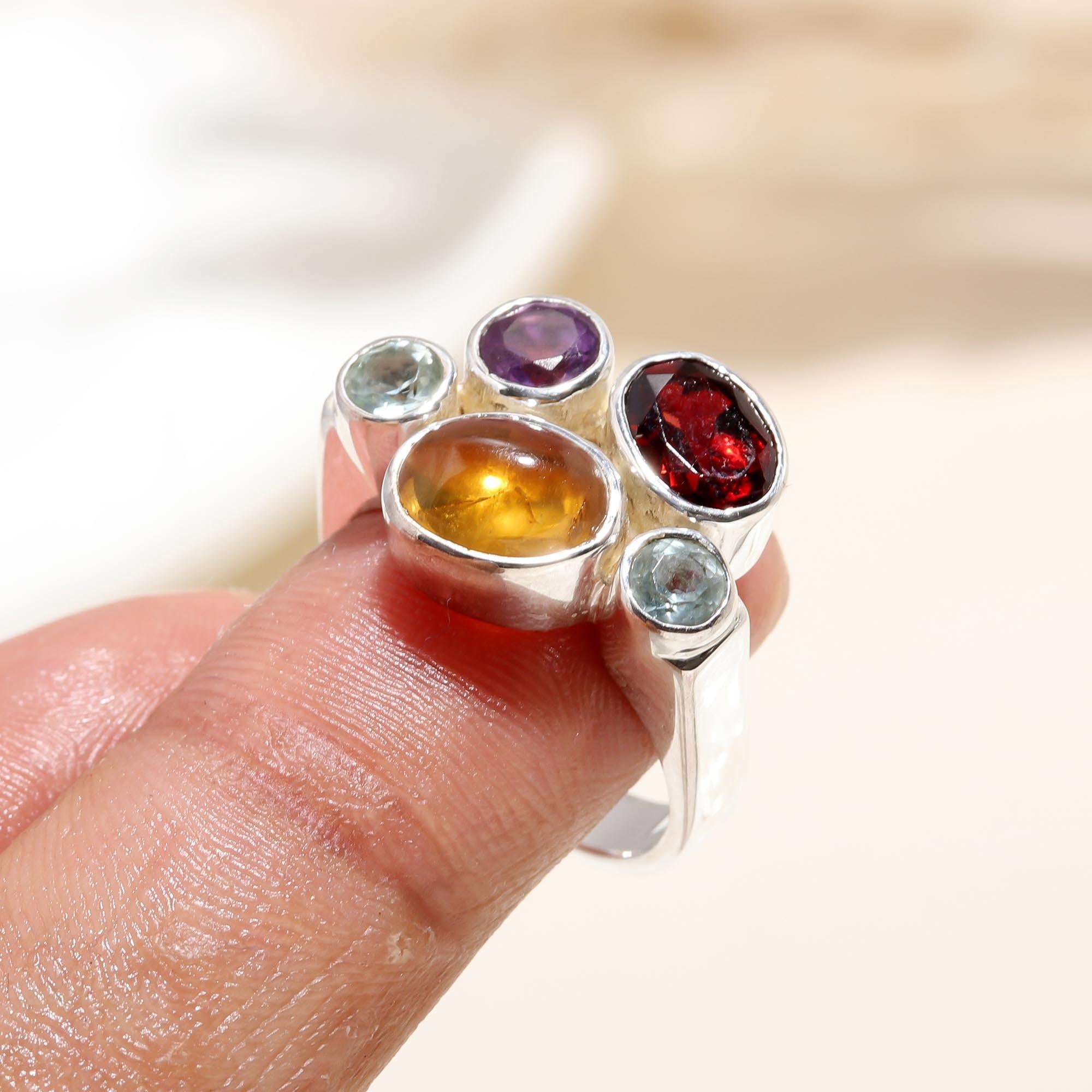 Multi gemstone silver ring on finger