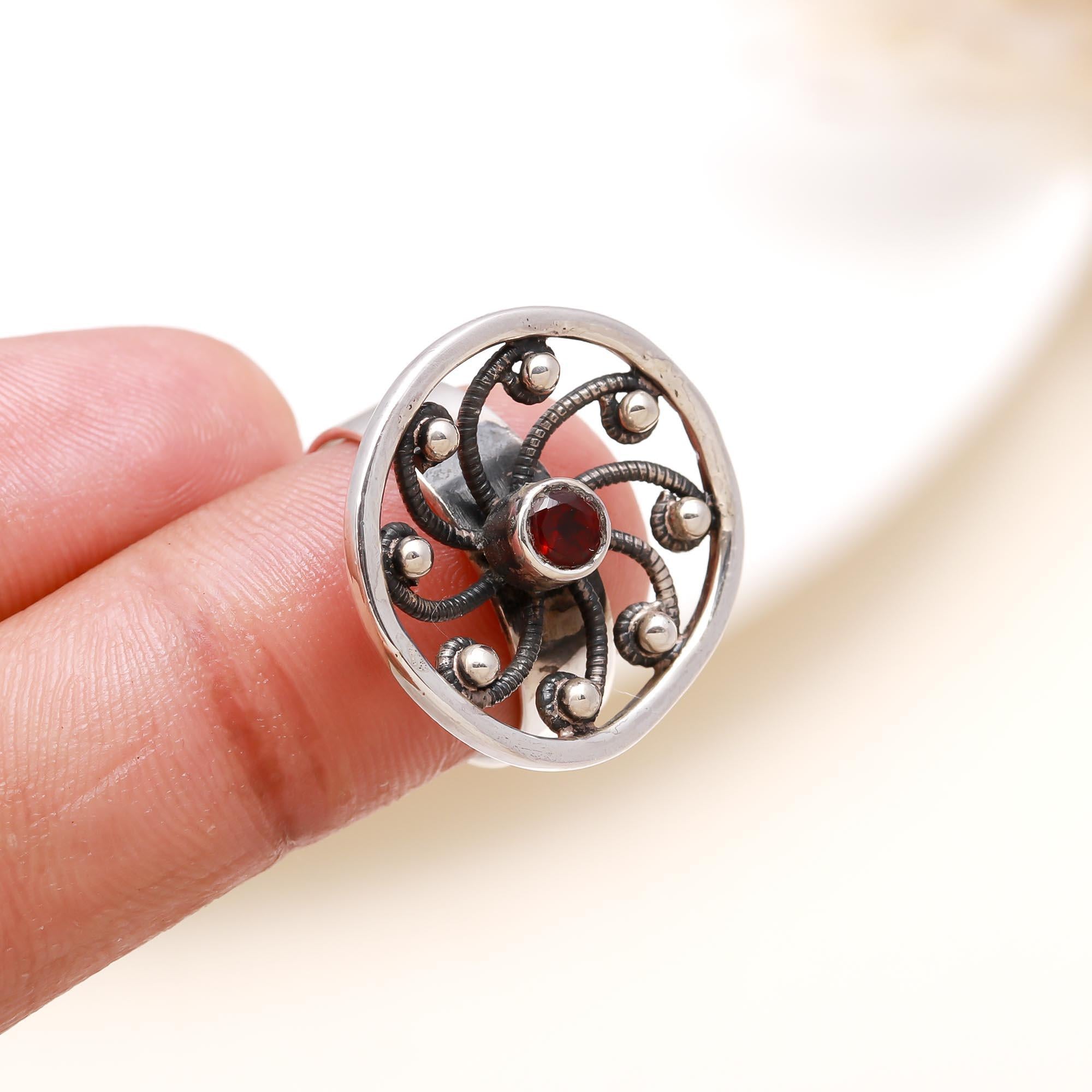 Elegant red garnet vintage statement ring on finger